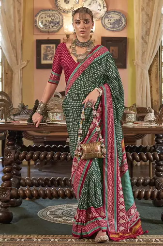 Dark green patola design zari work traditional silk blend saree