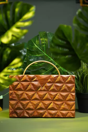 Handcarved geometric pattern handbag with halfmoon handle