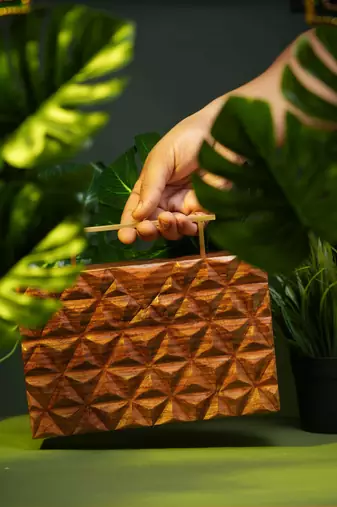 Handcarved geometric pattern handbag with rectangular handle