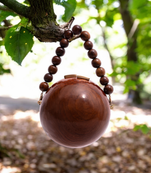 Wooden globe bag with beaded handle