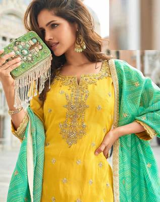 Yellow silk sharara with zari, sequin work & printed dupatta, free size stitching up to 42". 2