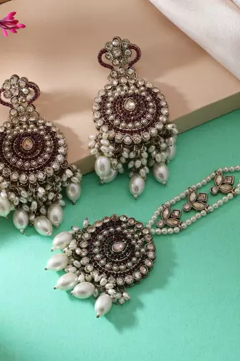 Magenta color kundan earrings tikka set
