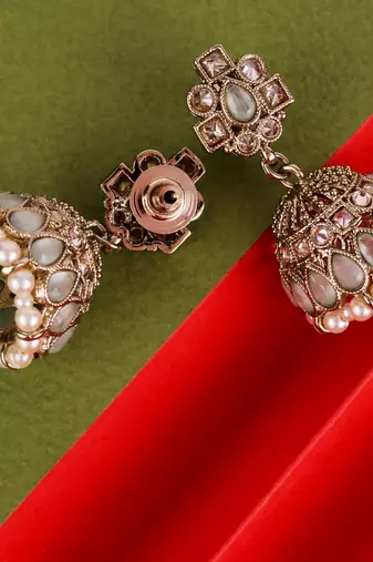 sky blue alloy jhumki with antique gold kundan stones