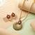 Pink color matte gold necklace set