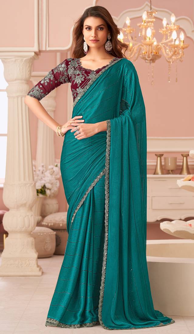 Turquoise chiffon embroidered party-wear-sarees with bridal embroiderd blouse