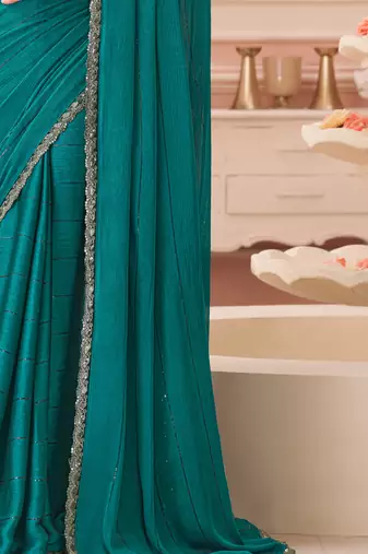 Turquoise chiffon embroidered party-wear-saree with bridal embroiderd blouse