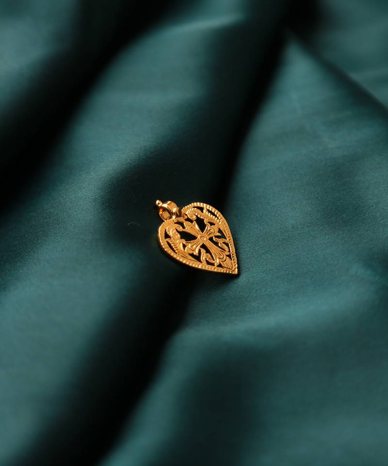 Gold-plated heart pendant with cross design