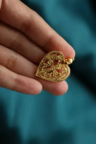Gold-plated heart pendant with cross design