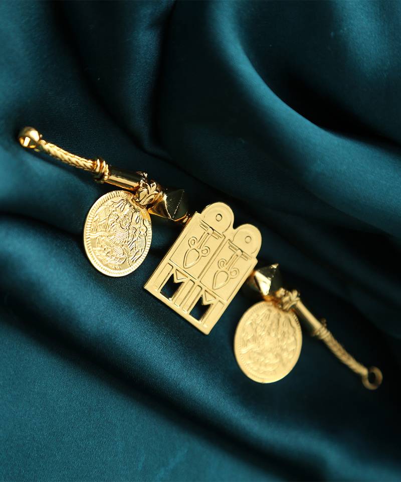 Traditional gold-plated tali pendant with temple door and coin motifs