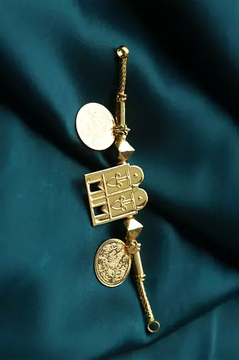 Traditional gold-plated tali pendant with temple door and coin motifs