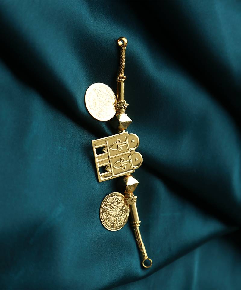 Traditional gold-plated tali pendant with temple door and coin motifs