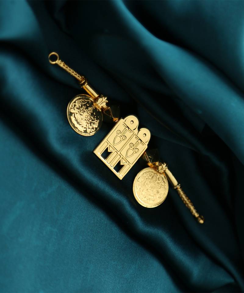 Traditional gold-plated tali pendant with temple door and coin motifs