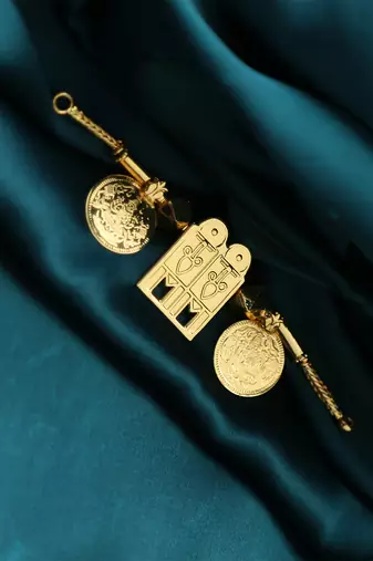 Traditional gold-plated tali pendant with temple door and coin motifs