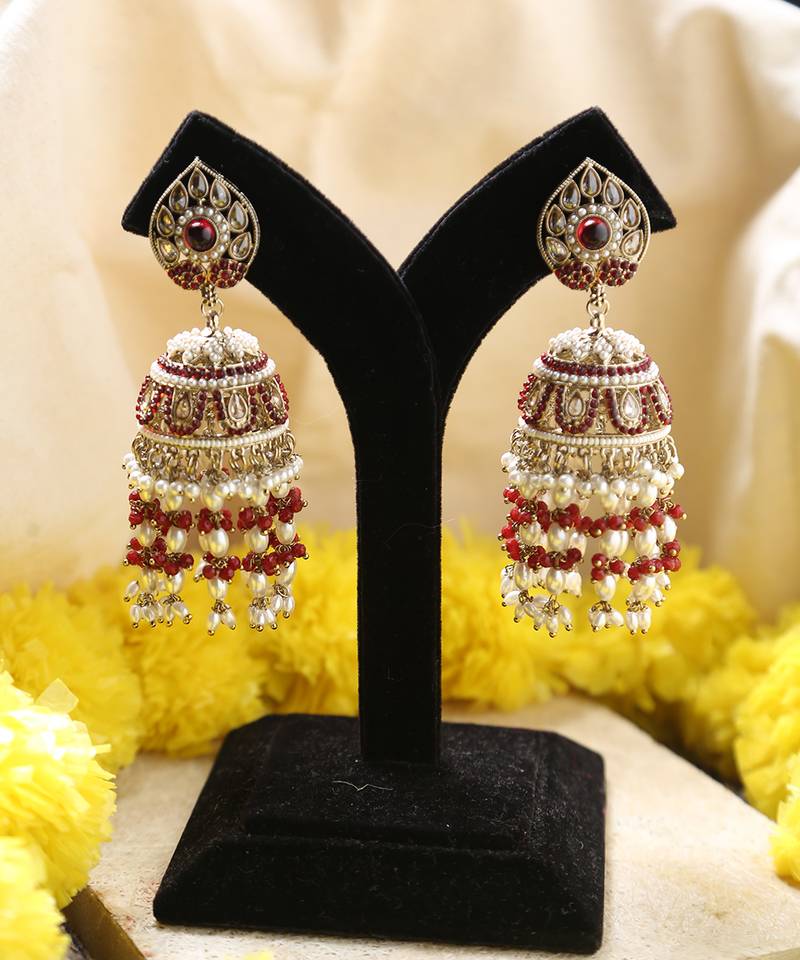 Gold jhumkas with red and white rice pearls