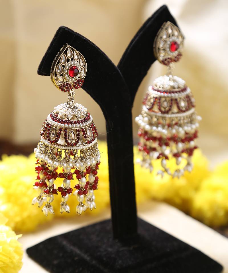 Gold jhumkas with red and white rice pearls
