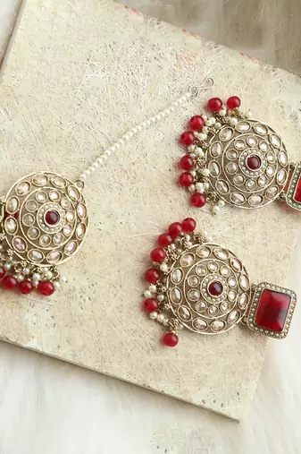 Kundan danglers with red beads and stone accents