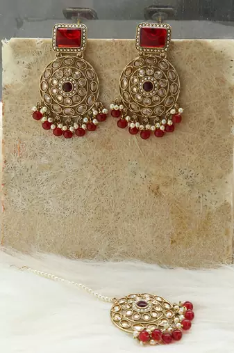 Kundan danglers with red beads and stone accents