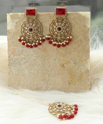 Kundan danglers with red beads and stone accents 1