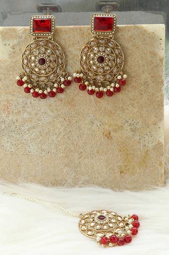 Kundan danglers with red beads and stone accents