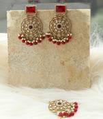 Kundan danglers with red beads and stone accents