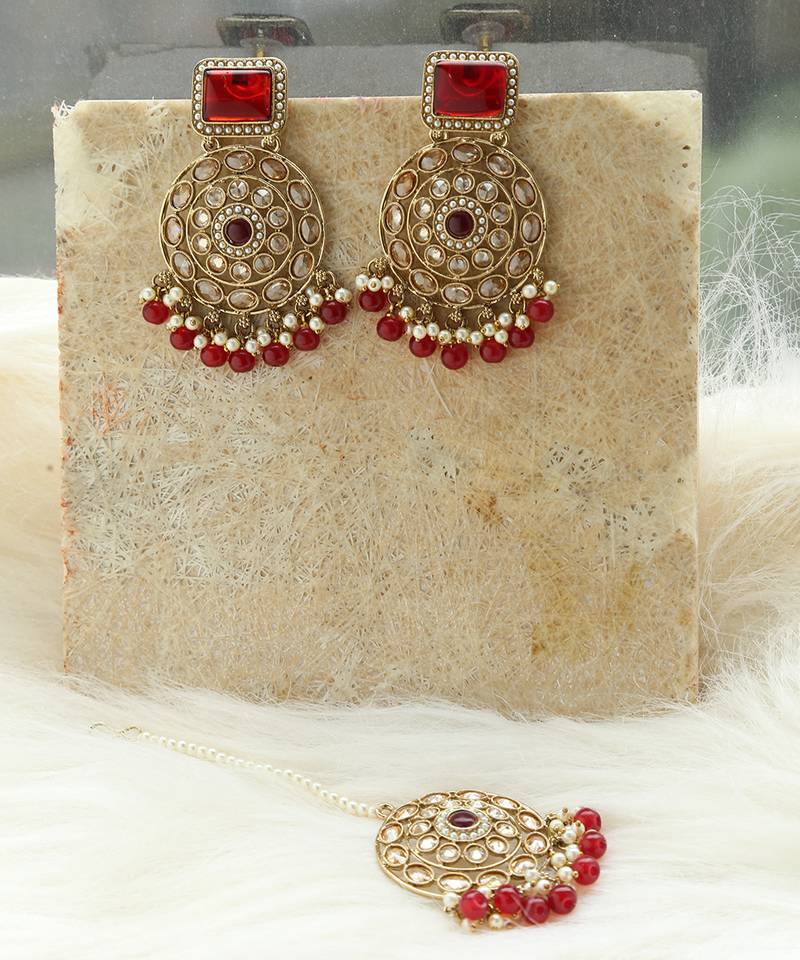 Kundan danglers with red beads and stone accents