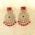 Kundan danglers with red beads and stone accents