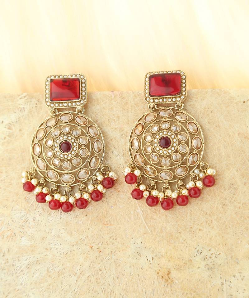 Kundan danglers with red beads and stone accents