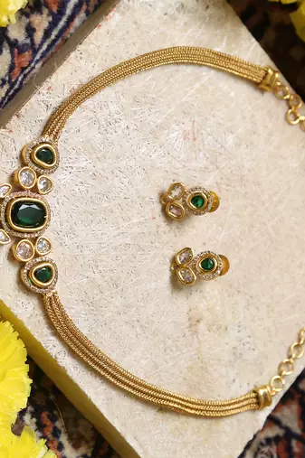 Gold-tone necklace with green & white stone 