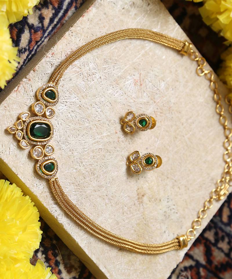 Gold-tone necklace with green & white stone