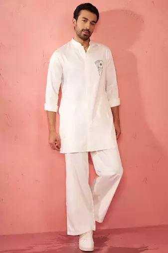 White fine satin stone work kurta with cream flare pant - festive set