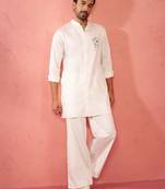 White fine satin stone work kurta with cream flare pant - festive set