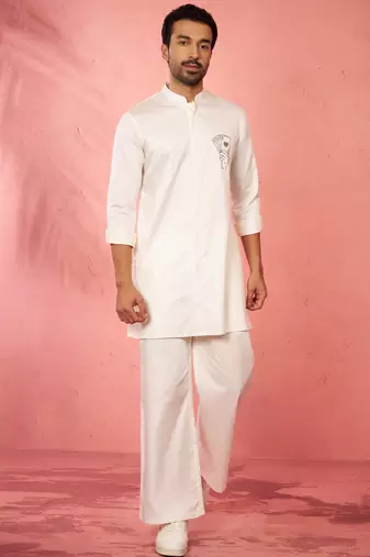 White fine satin stone work kurta with cream flare pant - festive set