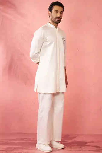 White fine satin stone work kurta with cream flare pant - festive set