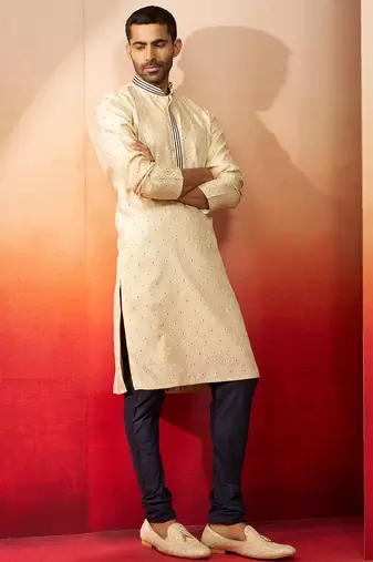 cream embroidered kurta with navy blue churidar - thread zari work set