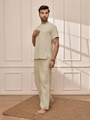 Premium beige cotton kurta palazzo set with back embroidery 4