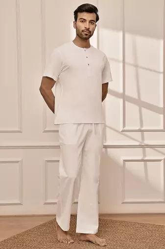 Pure white cotton kurta palazzo set with back embroidery
