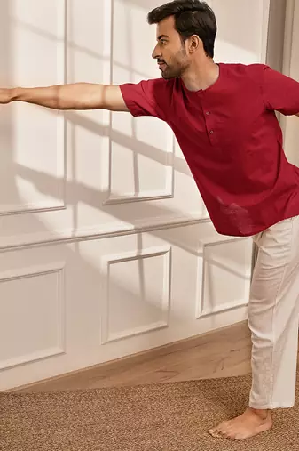 Red cotton kurta with om embroidery and white palazzo set