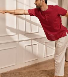 Red cotton kurta with om embroidery and white palazzo set