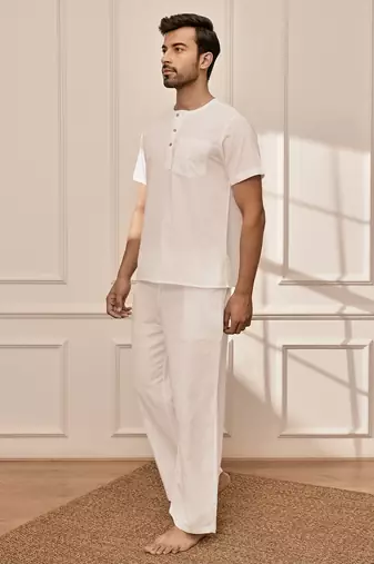 White cotton kurta with om embroidery and white palazzo set