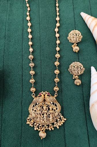 Antique gold plated temple necklace set featuring divine motifs and artistic craftsmanship perfect for festive occasions