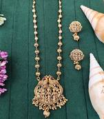 Antique gold plated temple necklace set featuring divine motifs and artistic craftsmanship perfect for festive occasions