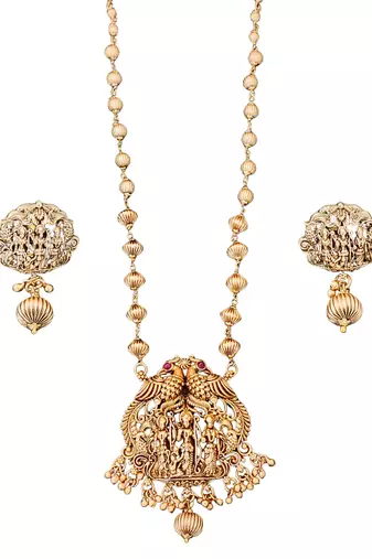 Antique gold plated temple necklace set featuring divine motifs and artistic craftsmanship perfect for festive occasions