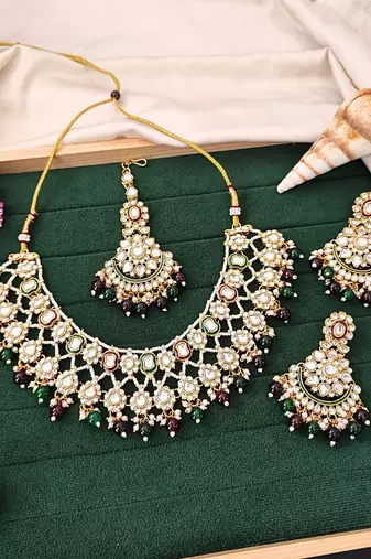 Kundan bridal necklace set with green and maroon beads | pearl embellished earrings & maang tikka for wedding wear