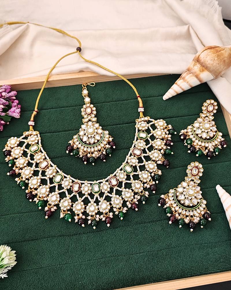 Kundan bridal necklace set with green and maroon beads | pearl embellished earrings & maang tikka for wedding wear