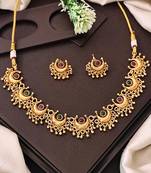 Gold plated necklace and earrings set with crescent motifs and multicolored stones – perfect for festive and ethnic wear