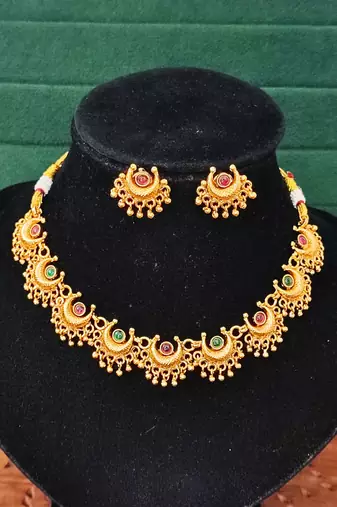 Gold plated necklace and earrings set with crescent motifs and multicolored stones – perfect for festive and ethnic wear