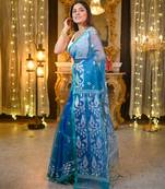 Teal pure muslin silk saree with green border and woven motifs