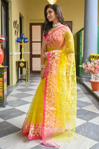 Yellow  muslin silk blend saree with pink border and woven motifs
