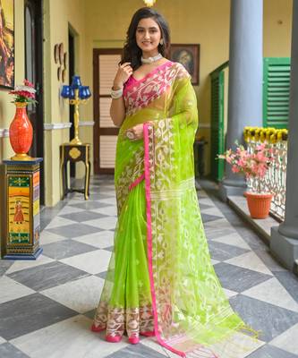 Green  muslin silk blend saree with pink border and woven motifs 1