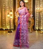 Purple pure muslin silk saree with red border and woven motifs
